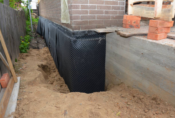 SJ Waterproofing Pros technician performing targeted Waterproofing assessment in Newtown, IN